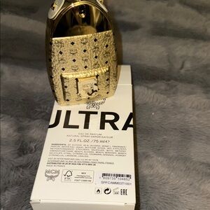 Brand new MCM Gold Perfume Bottle